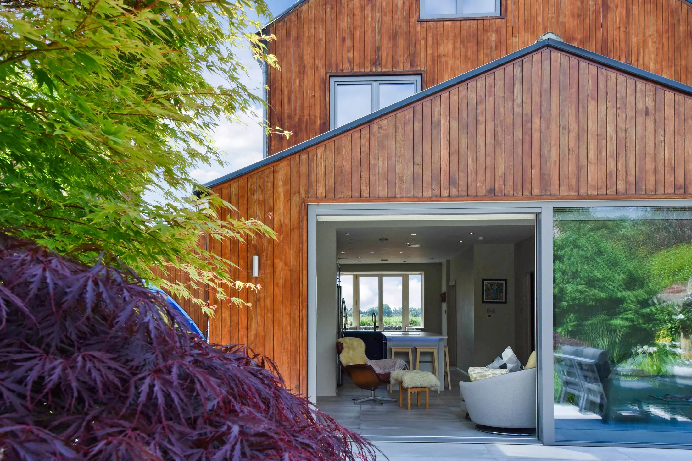 Highclear's living space opening through to the mature garden